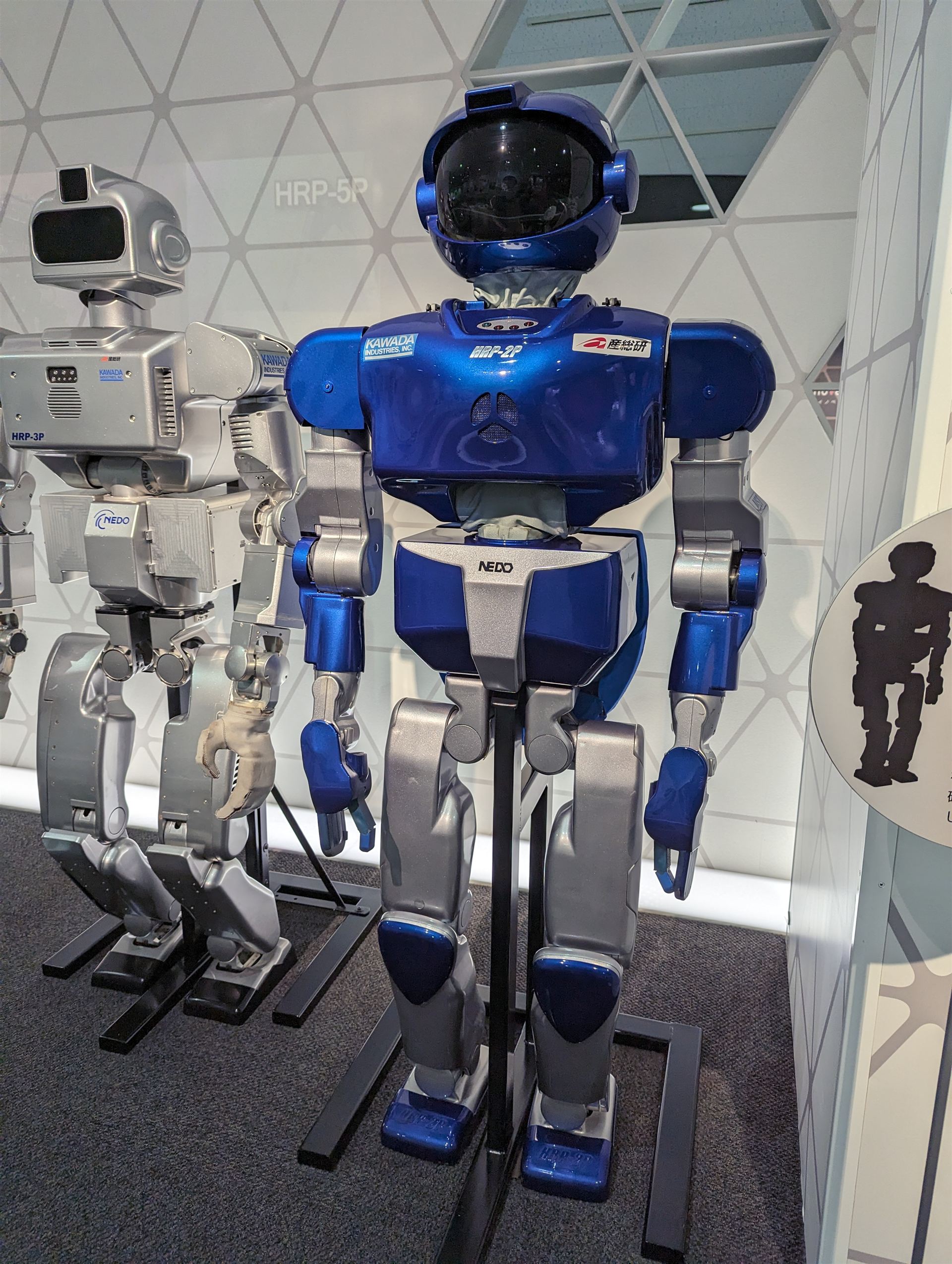 Humanoid robot standing in a research facility in Japan