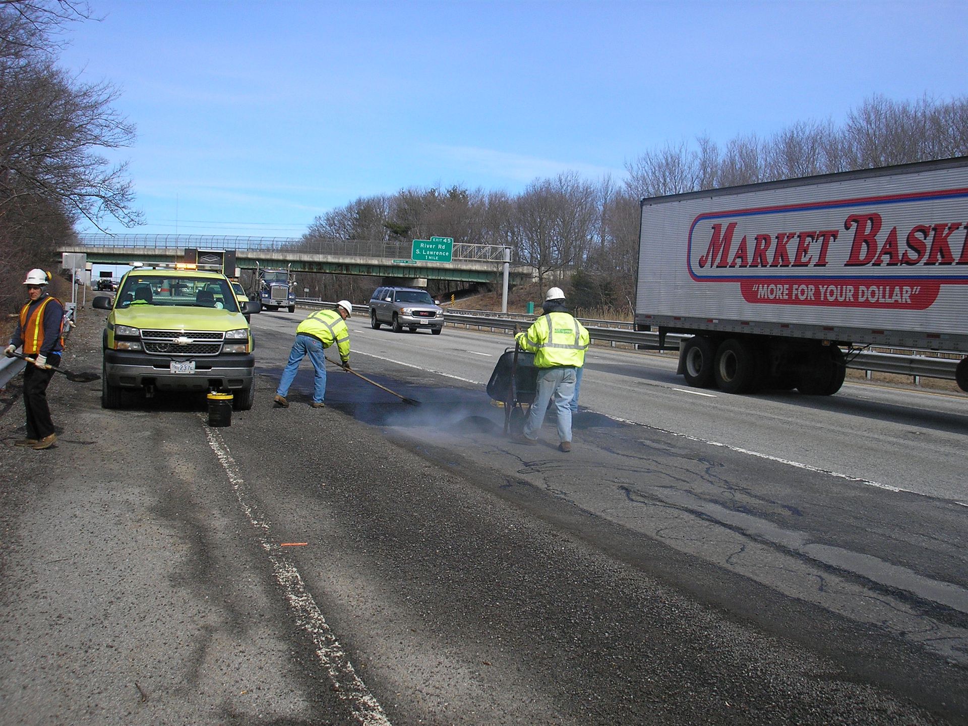 Road pothole repair crews on I-93, Massachusetts