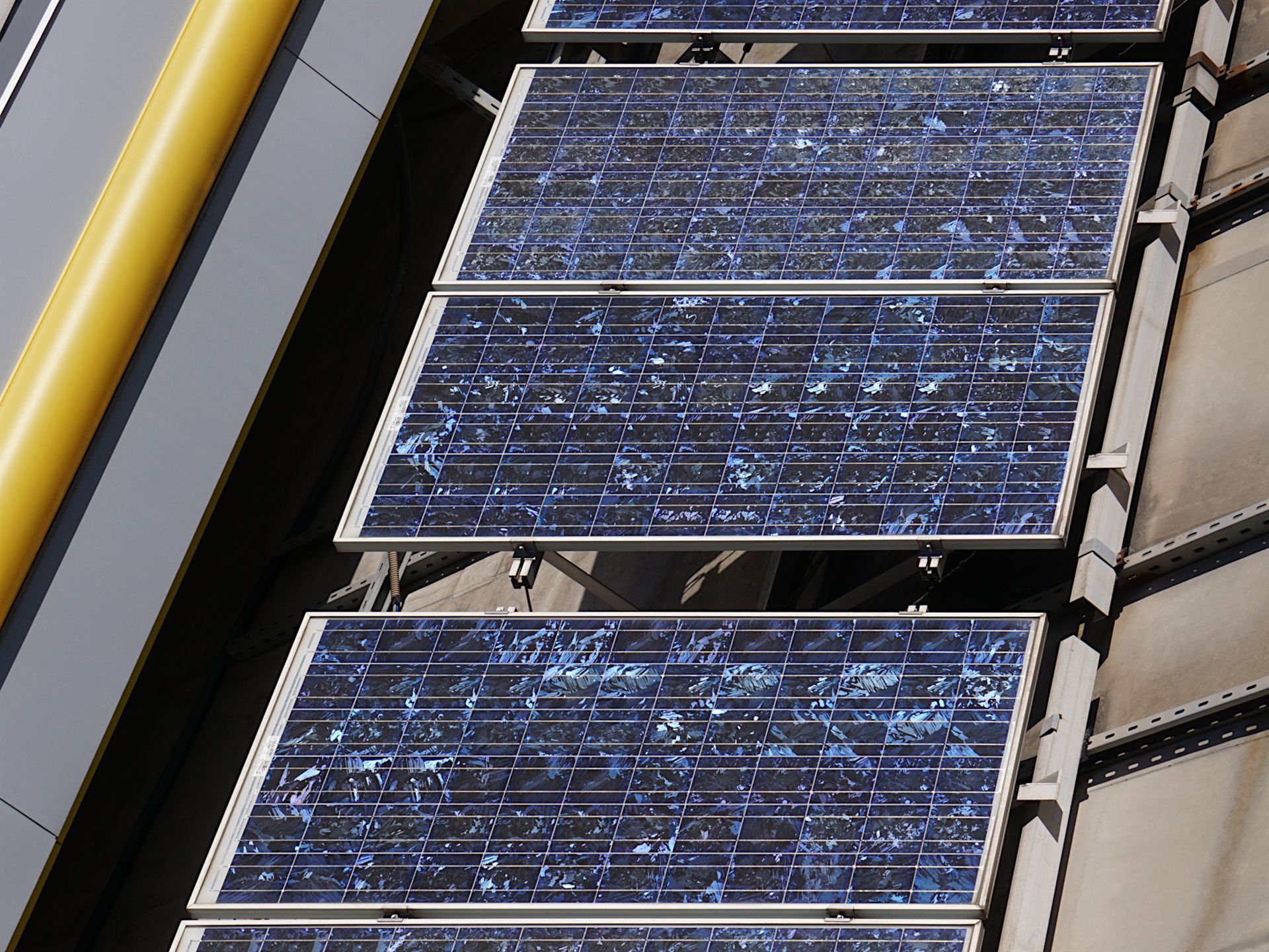 Polycrystalline silicon solar panels - blue speckled colour on rooftop