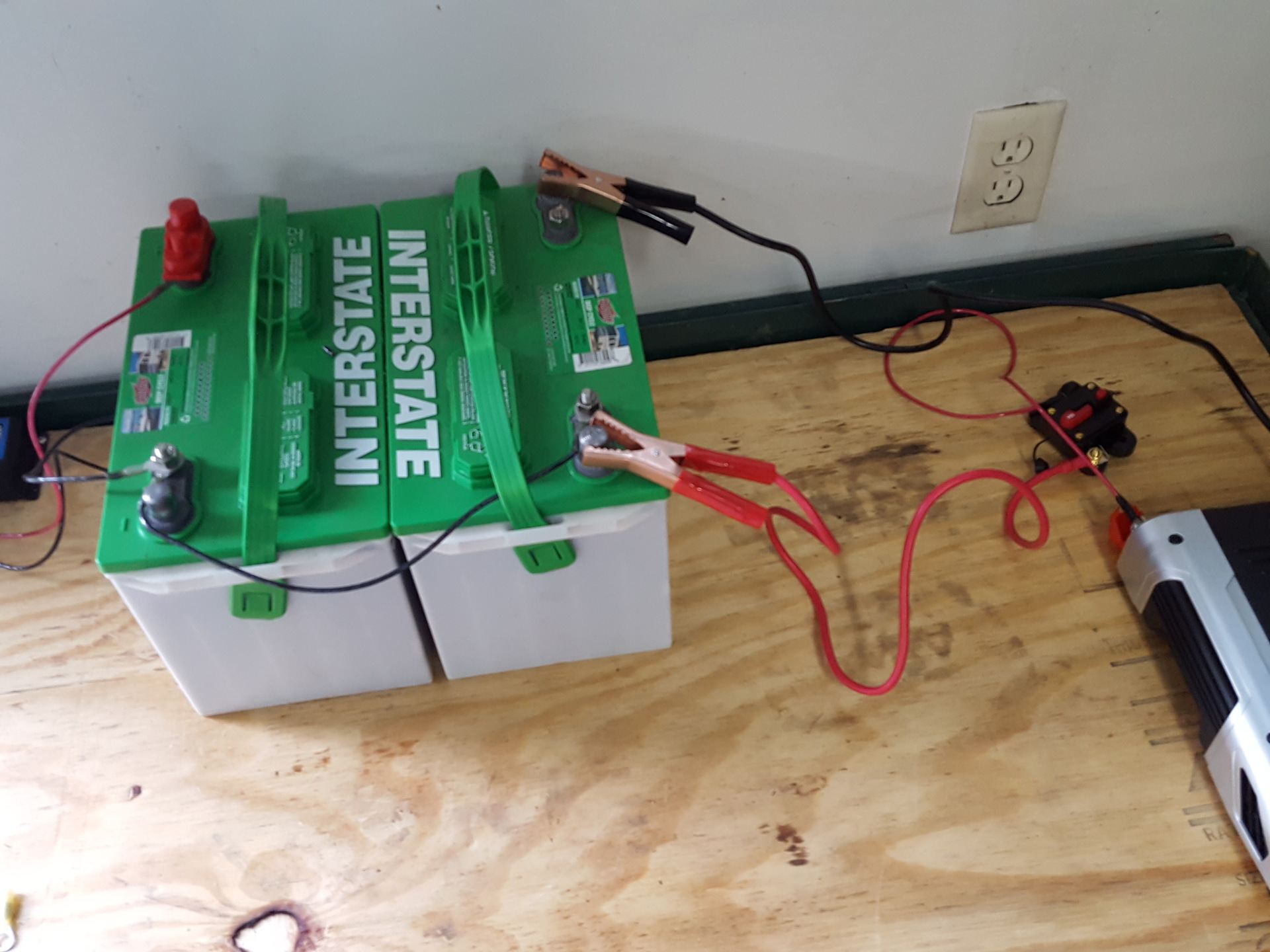 Deep-cycle lead-acid battery bank connected in series for solar storage
